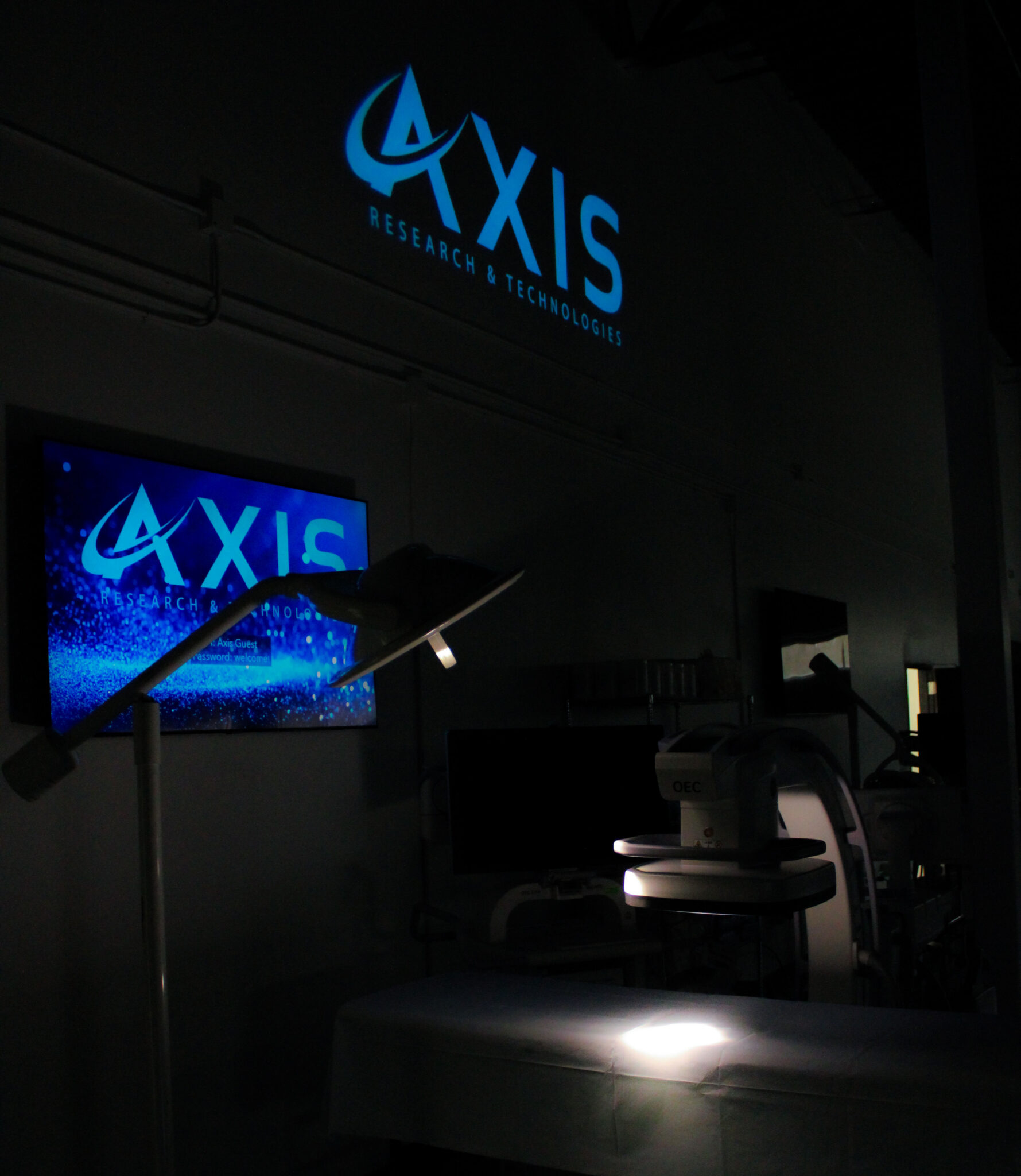 axis research and technologies logos in dark bioskills lab